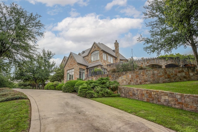 view of home's exterior with a lawn