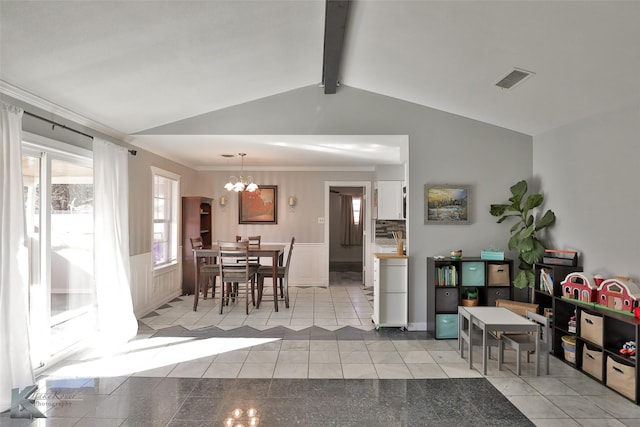 interior space featuring lofted ceiling with beams and an inviting chandelier