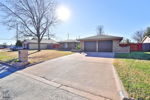 ranch-style house with a front yard and a garage