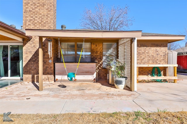 doorway to property with a patio area