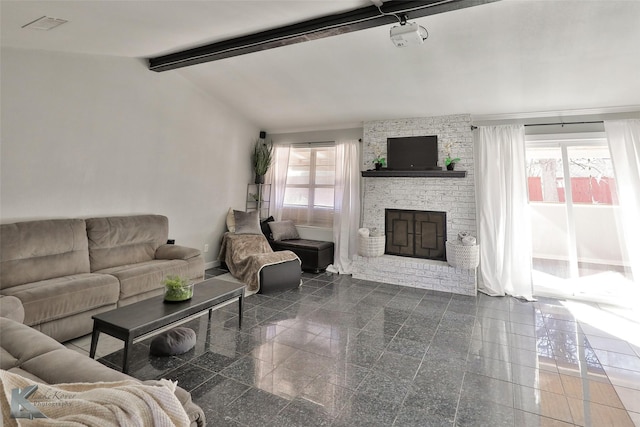 living room featuring lofted ceiling with beams and a brick fireplace