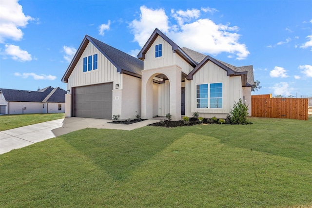 view of front of home with a garage and a front yard