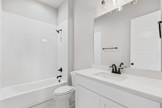 full bathroom featuring tiled shower / bath combo, toilet, and vanity