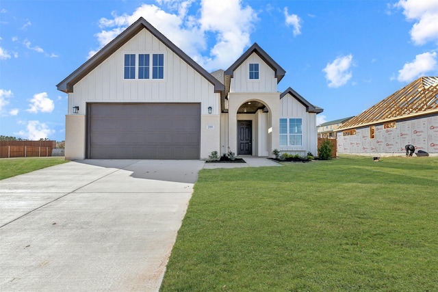 modern farmhouse style home with a garage and a front yard