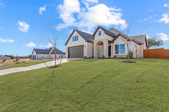 view of front facade featuring a garage and a front lawn