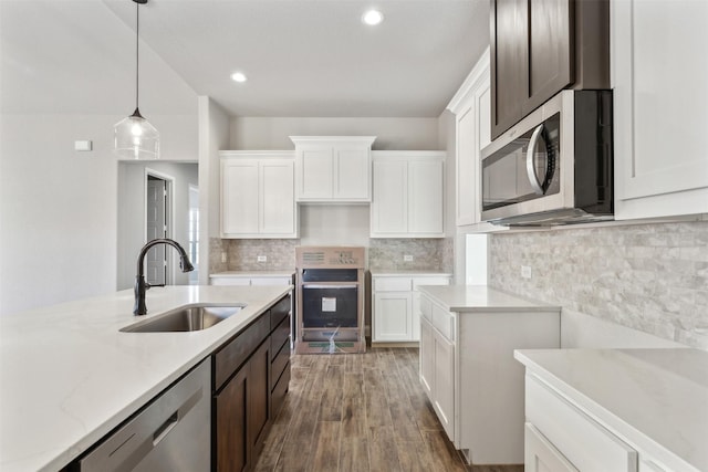 kitchen with white cabinetry, sink, and appliances with stainless steel finishes