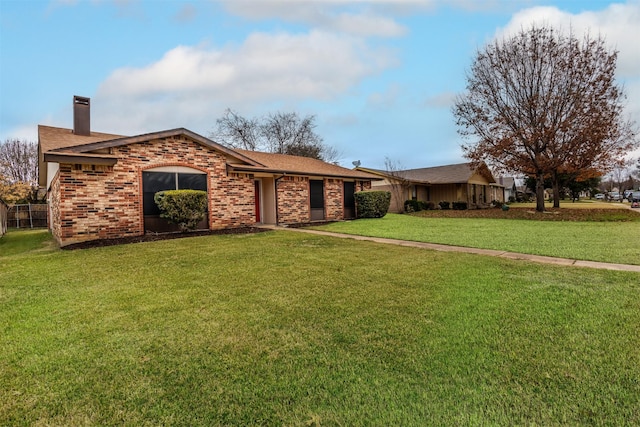 ranch-style home with a front lawn