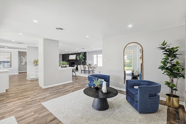 sitting room with light hardwood / wood-style floors