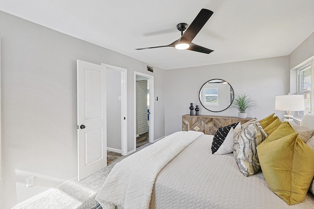 carpeted bedroom featuring ceiling fan