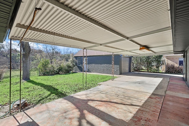 view of patio featuring a garage