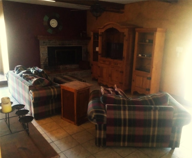 living room featuring light tile patterned flooring and a fireplace