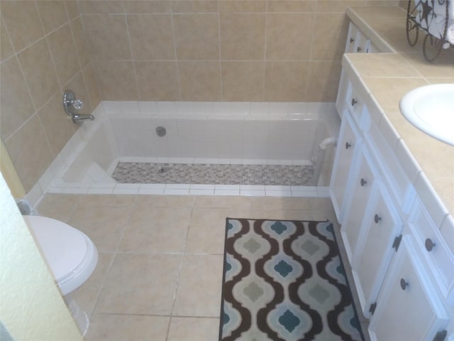 bathroom featuring tile patterned flooring, vanity, and toilet