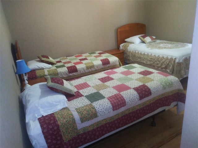 bedroom featuring hardwood / wood-style flooring