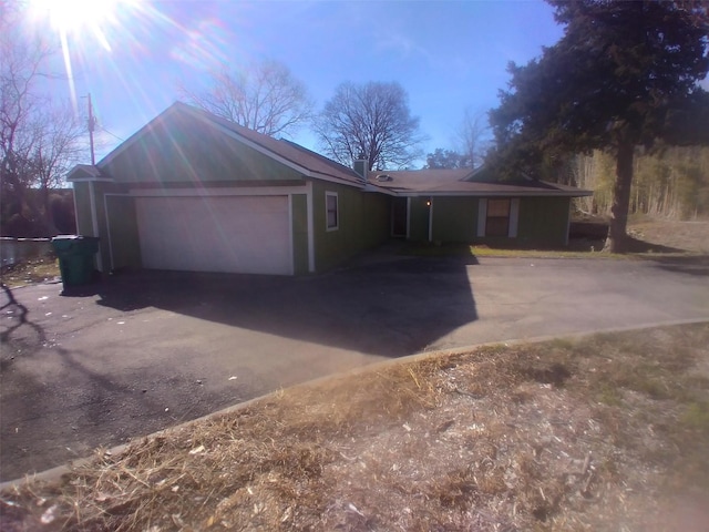 single story home featuring a garage