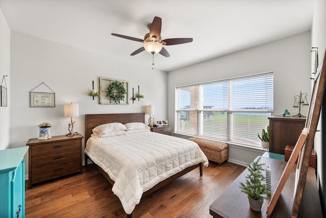 bedroom featuring ceiling fan and dark hardwood / wood-style floors