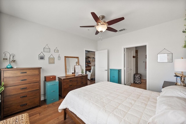 bedroom with wood-type flooring and ceiling fan