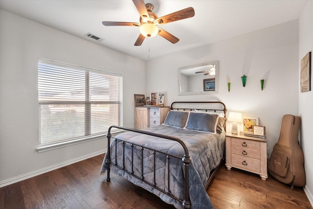 bedroom featuring ceiling fan and dark wood-type flooring