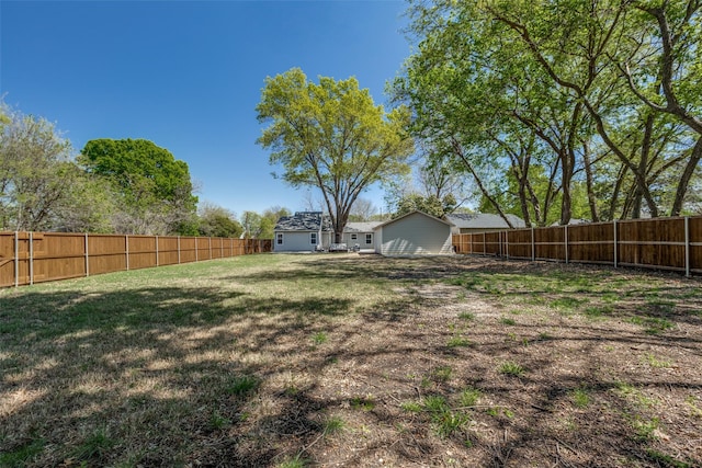 view of yard with a fenced backyard