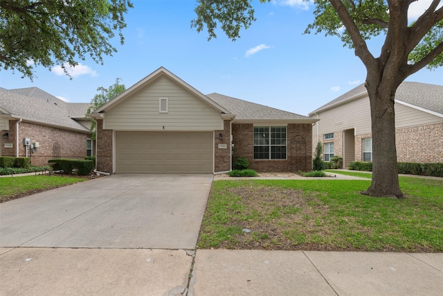 ranch-style home with a garage and a front yard