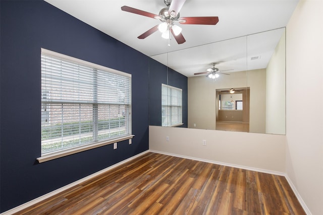 unfurnished room featuring dark hardwood / wood-style flooring