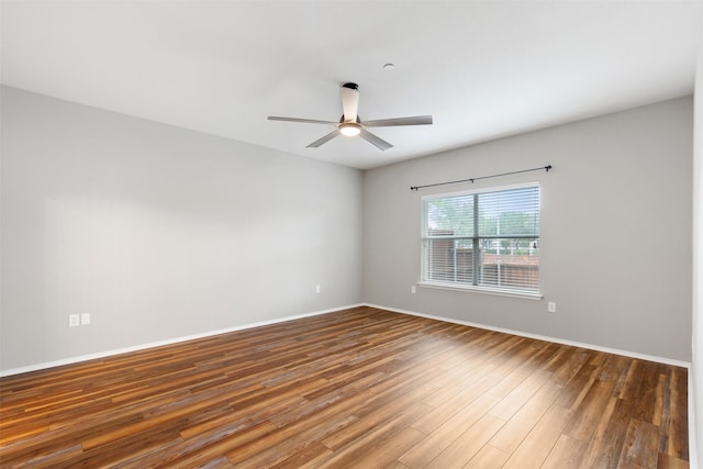 empty room with hardwood / wood-style flooring and ceiling fan