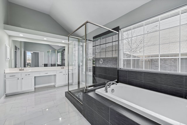 bathroom with vanity, separate shower and tub, and lofted ceiling