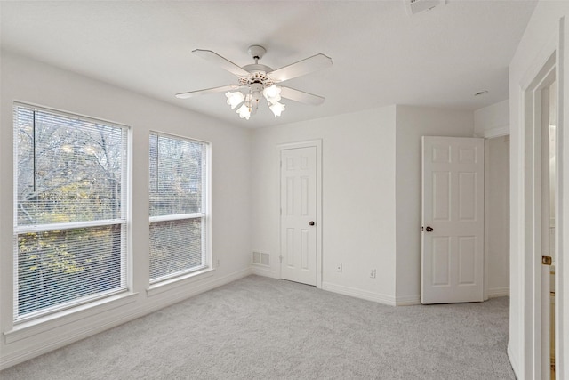 unfurnished bedroom featuring ceiling fan and light colored carpet