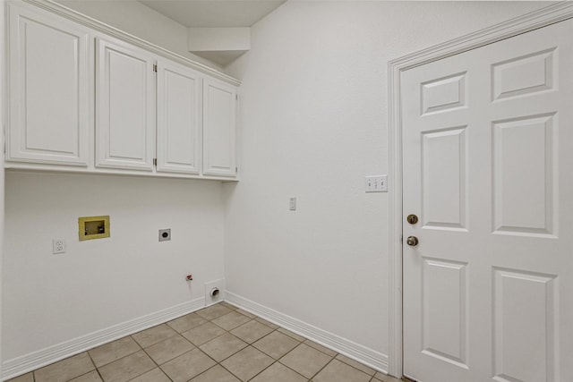 clothes washing area with cabinets, electric dryer hookup, hookup for a gas dryer, hookup for a washing machine, and light tile patterned floors