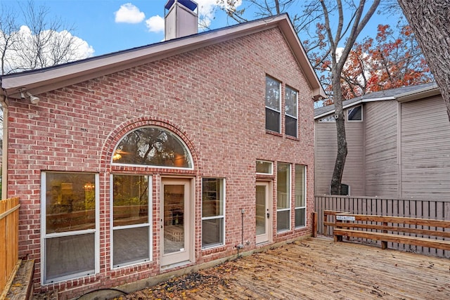 back of house with a wooden deck