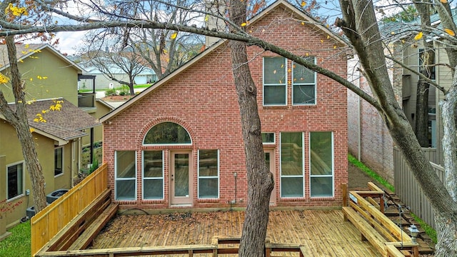 rear view of house featuring a deck