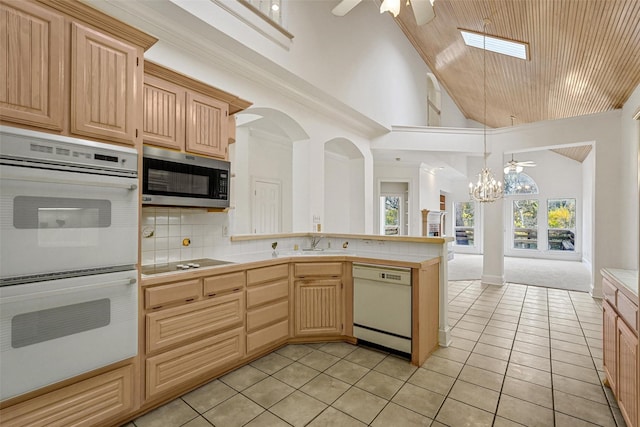 kitchen with decorative backsplash, light brown cabinets, wooden ceiling, and white appliances