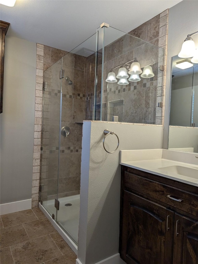 bathroom with vanity and walk in shower