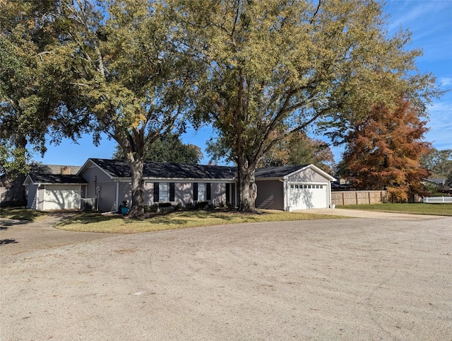 single story home featuring a garage