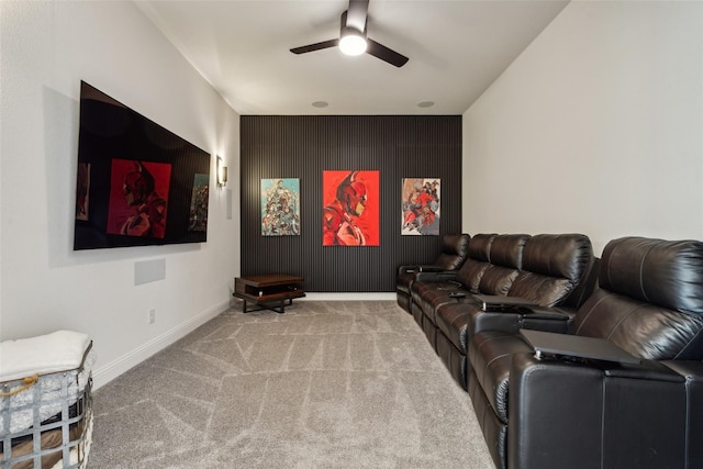 home theater with ceiling fan and carpet floors