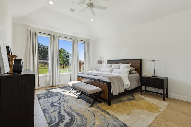 bedroom featuring vaulted ceiling, light hardwood / wood-style flooring, and ceiling fan