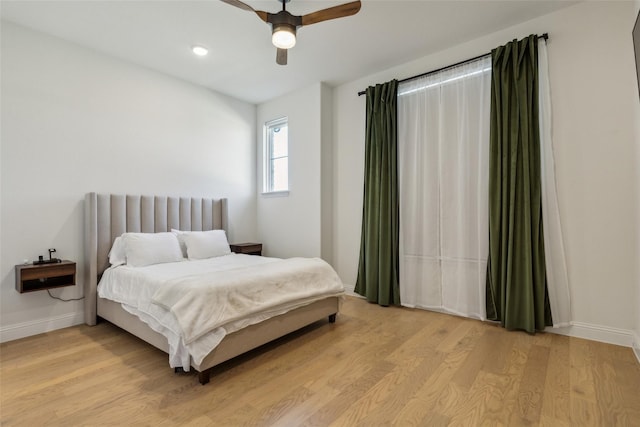 bedroom featuring ceiling fan and light hardwood / wood-style floors