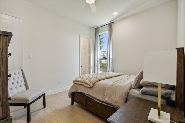 bedroom featuring ceiling fan and light hardwood / wood-style floors