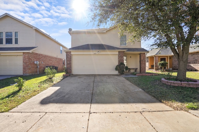 view of front property with a garage and a front lawn