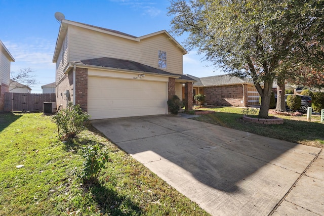 front facade with a garage, a front yard, and cooling unit