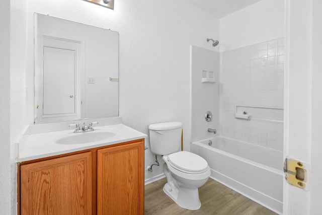 full bathroom with vanity, hardwood / wood-style flooring, shower / tub combination, and toilet