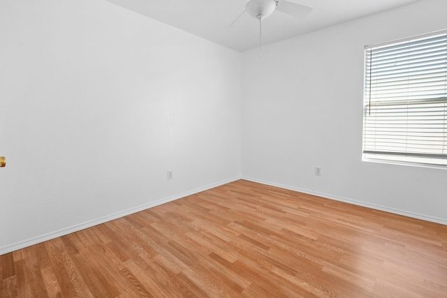 unfurnished room featuring ceiling fan, a healthy amount of sunlight, and light wood-type flooring