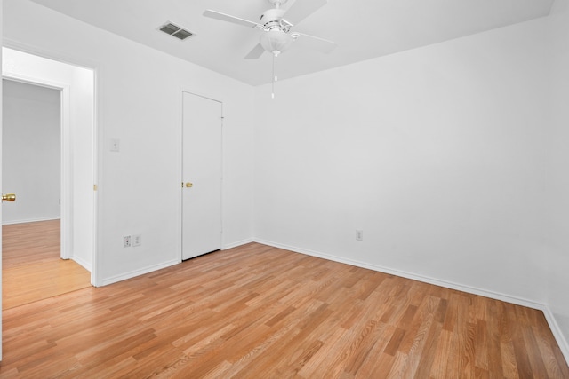 spare room featuring ceiling fan and light hardwood / wood-style flooring