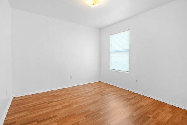 spare room featuring light hardwood / wood-style flooring