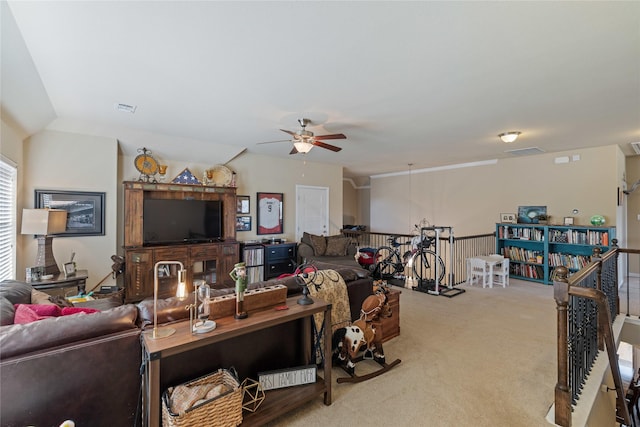 carpeted living room featuring ceiling fan