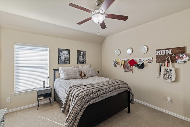 carpeted bedroom featuring ceiling fan and lofted ceiling