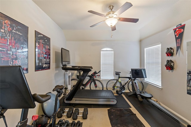 workout area featuring ceiling fan and lofted ceiling