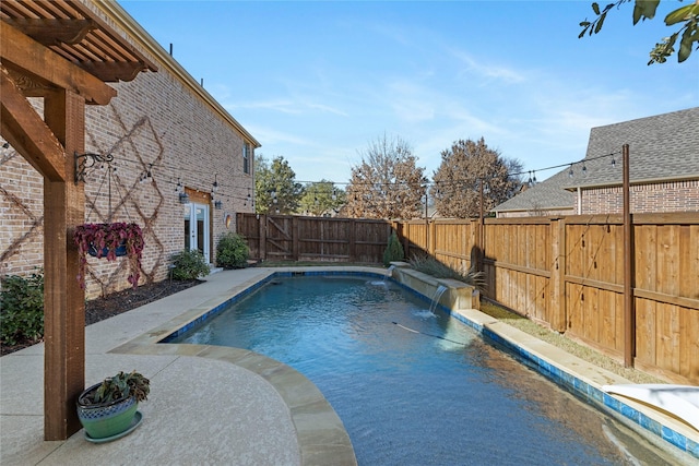 view of pool with pool water feature and a patio area