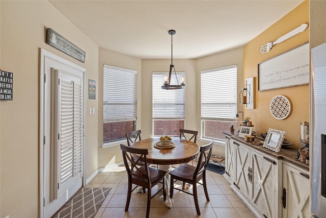 dining space featuring light tile patterned floors