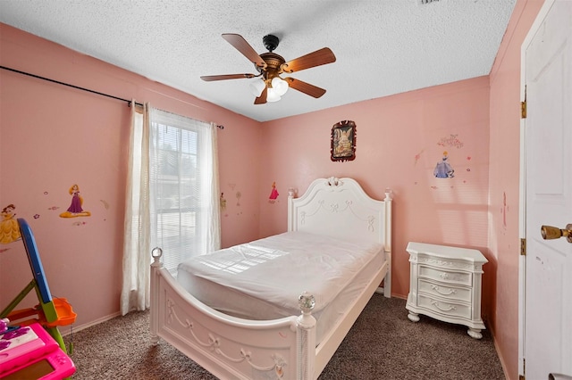 carpeted bedroom featuring ceiling fan and a textured ceiling