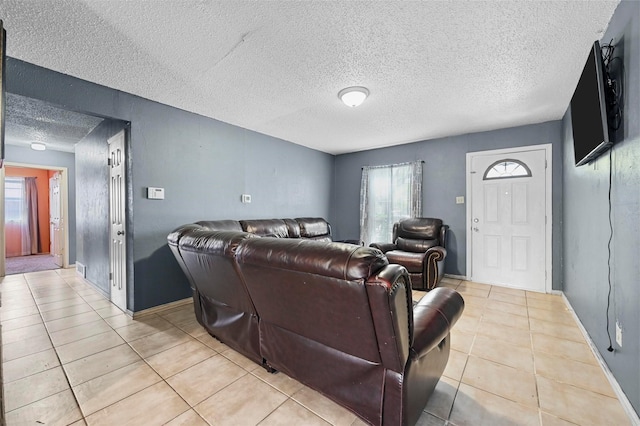 tiled living room featuring a textured ceiling